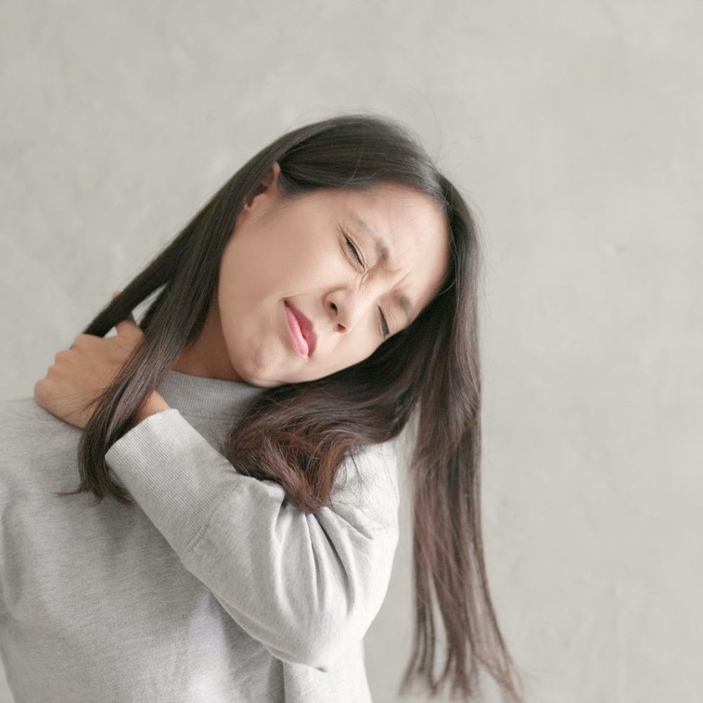 Woman feeling shoulder pain Woman feeling shoulder pain